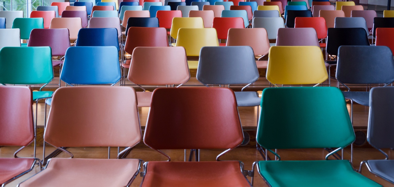 empty auditorium with colorful chair lines