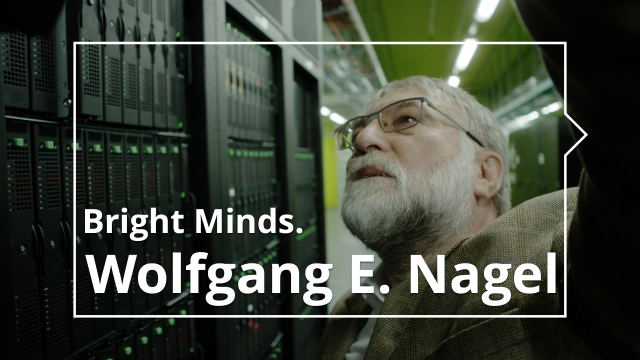 Image excerpt from the video series 'Brights Minds' with Prof. Nagel in front of giant processors