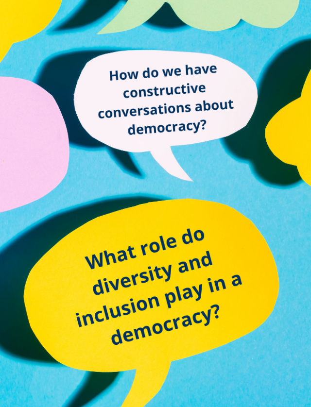 The image shows several colored speech bubbles on a blue background. Two of the speech bubbles contain questions about democracy: “How do we engage in constructive conversations about democracy?” and “What role do diversity and inclusion play in a democra