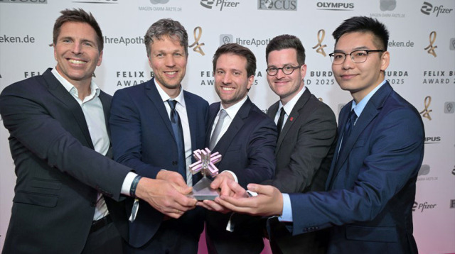  Winning photo: 5 men holding the prize together